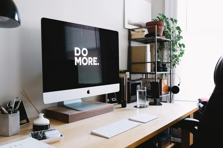 Woman setting up her business at a desk