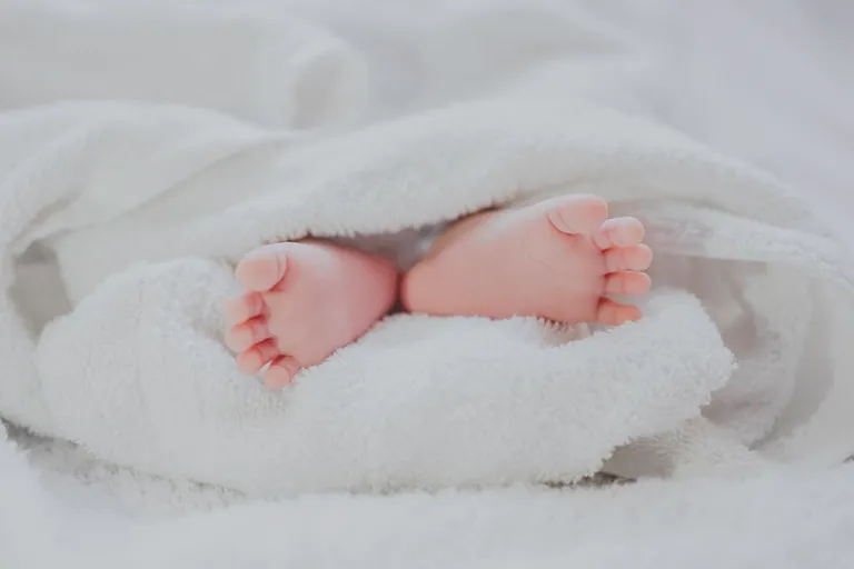 Baby sleeping peacefully in a crib